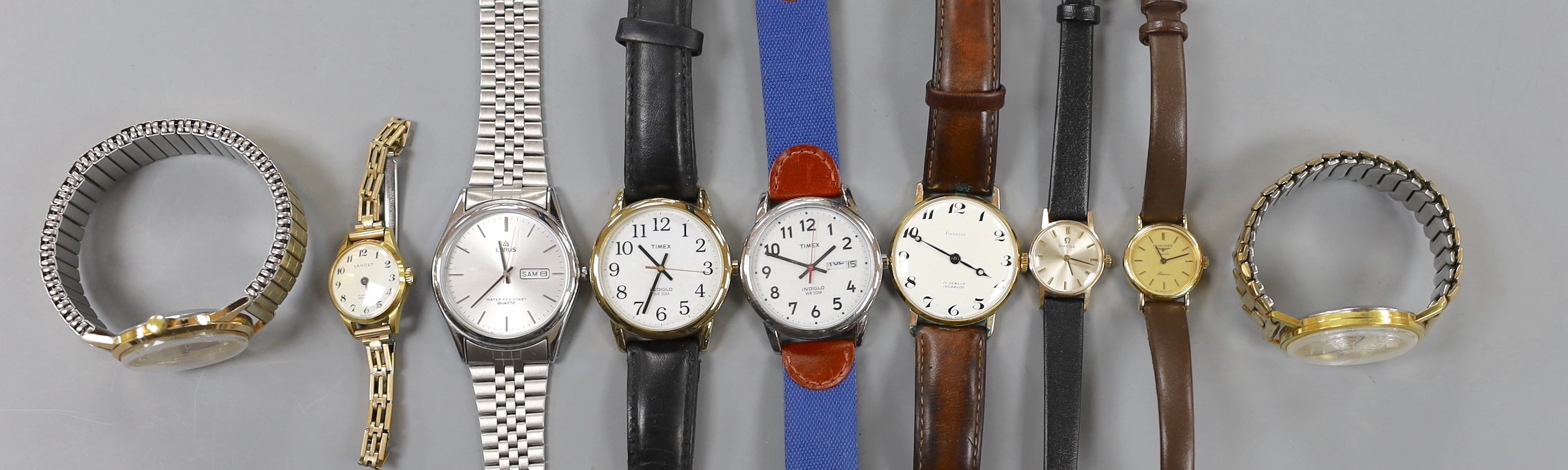 A lady's yellow metal Omega manual wind wrist watch and a group of assorted wrist watch including Lorus, Timex etc.